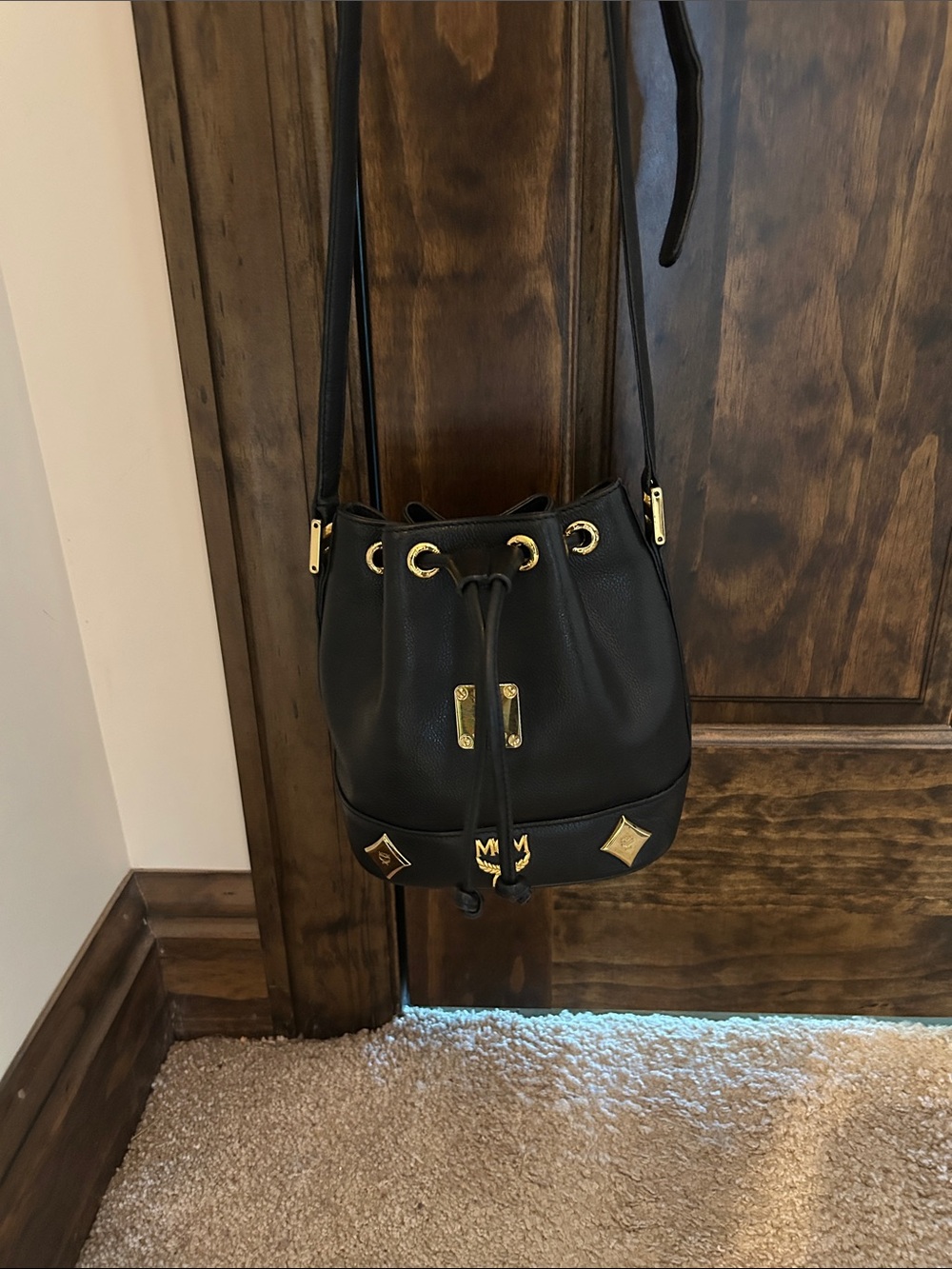 MCM Black Leather Mini Drawstring Bucket Bag with Gold Accents